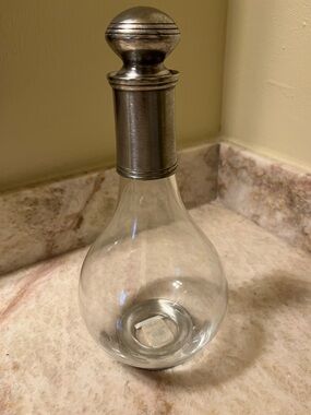 Glass decanter with pewter top